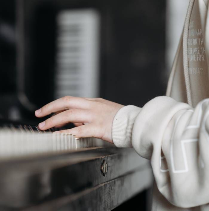 One creative young woman composing music