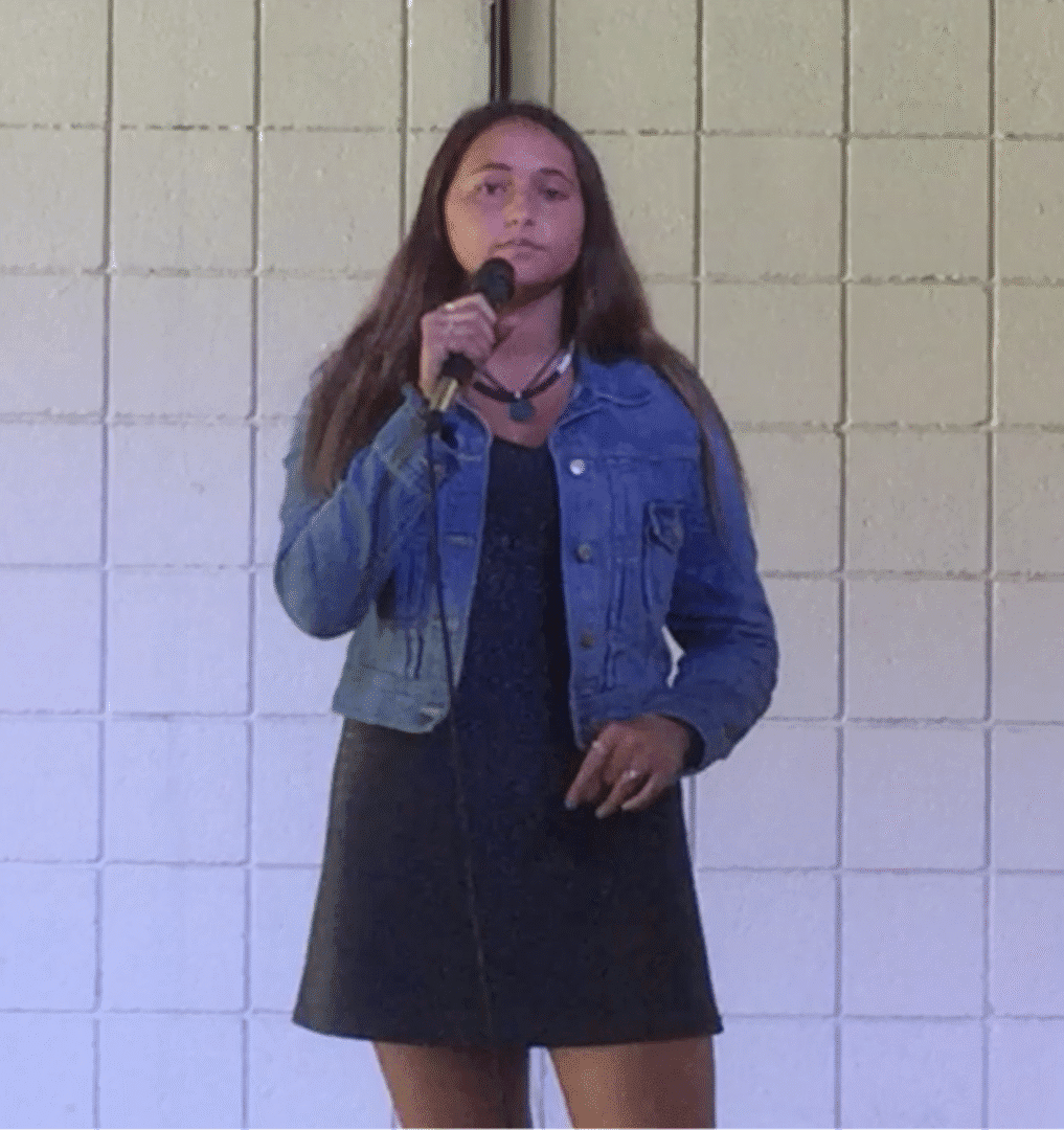 THE SECRET SKILL THAT CHANGES EVERYTHING Person singing with microphone on stage.
